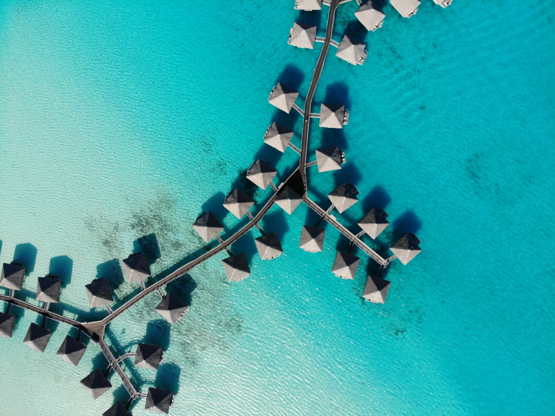 Aerial view of overwater bungalows in Bora Bora